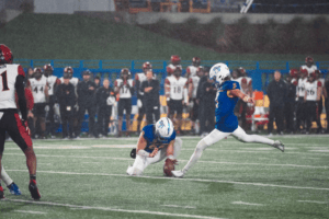 Kyler Halvorsen Kicking With Alex Weir Holding 2